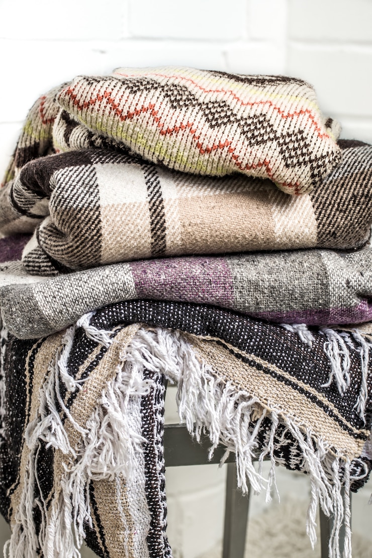 Free Photo warm blankets on a chair