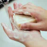 Free photo washing hands with a bar soap