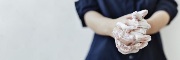 Washing hands with soap to prevent coronavirus contamination