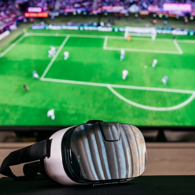 Watching football concept with vr glasses