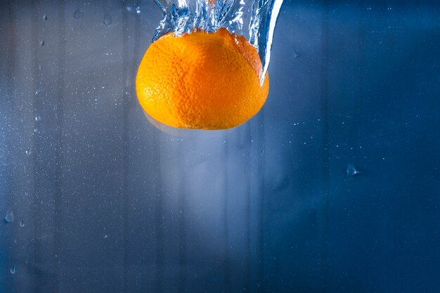 Water background with orange