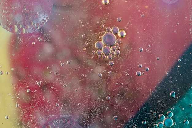 Water bubbles over the painted textured backdrop