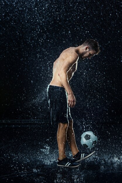 Water drops around football player