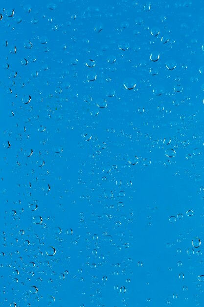 Water drops on blue surface