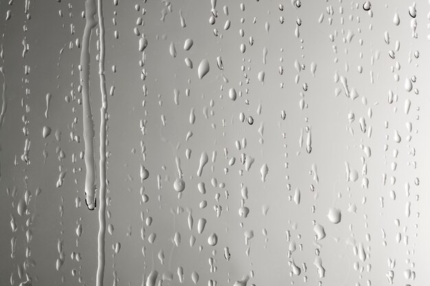 ガラスの窓の背景に水滴 プレミアム写真