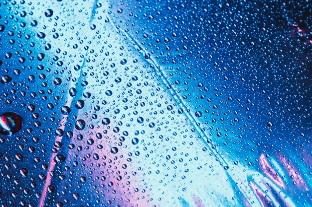 Water drops pattern on bright blue background