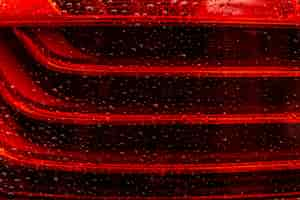 Free photo water drops on red glass