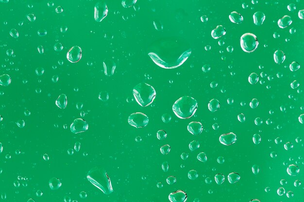 Water on emerald background