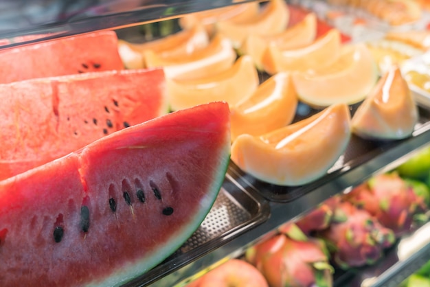 Water melon slices on bar in restaurant .