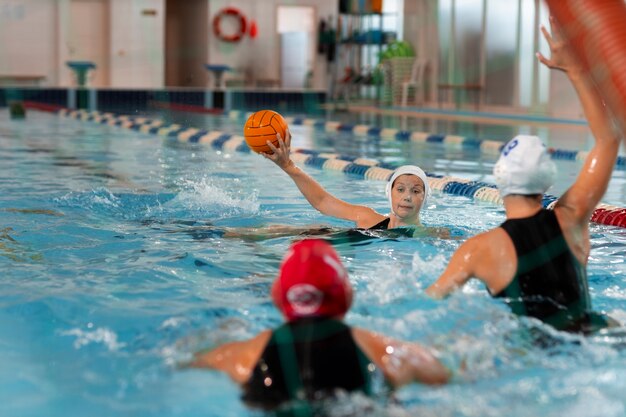 water polo players at the pool with swimming equipment