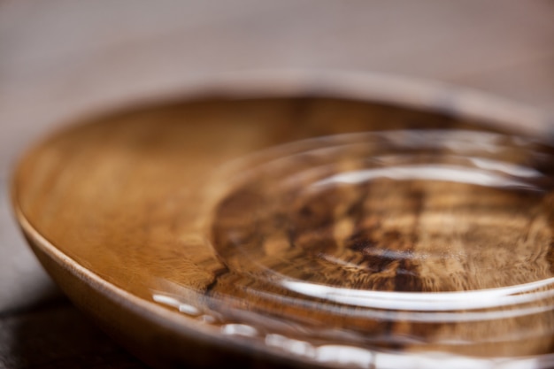 Water ripples in a wooden bowl