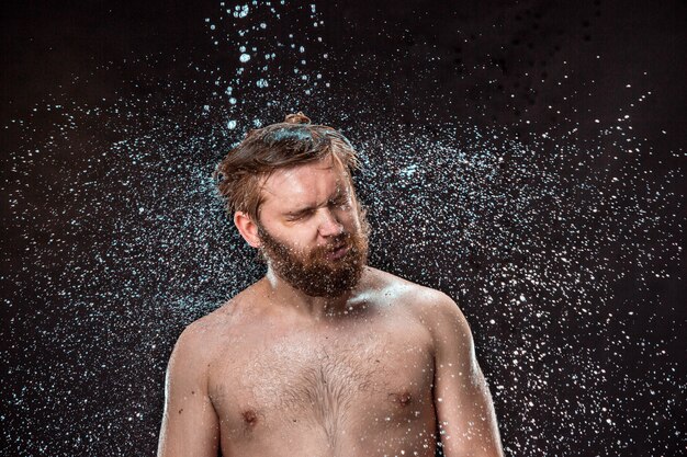 The water splash on male face