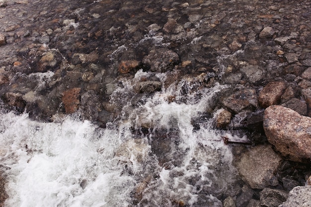 Water splashes against the rocks 