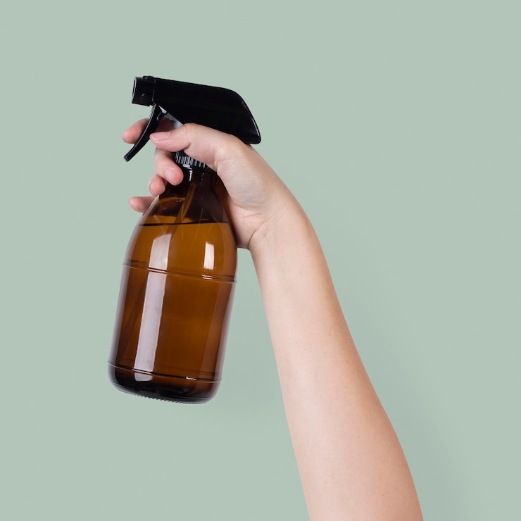 Free Photo water spray mist held by a raised hand