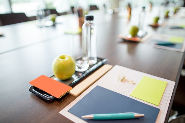 Water and Stationery Set on Conference Table