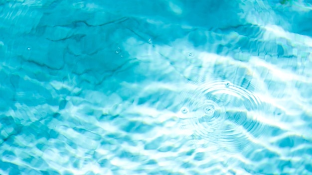 Water swimming pool texture and surface water on pool reflection blue wave nature water on the outdo...