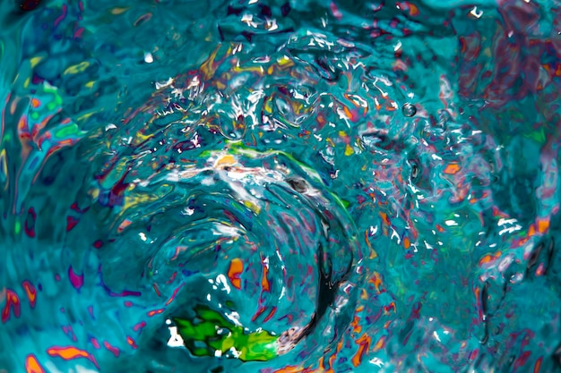 Free photo water waves and colourful splashes top view