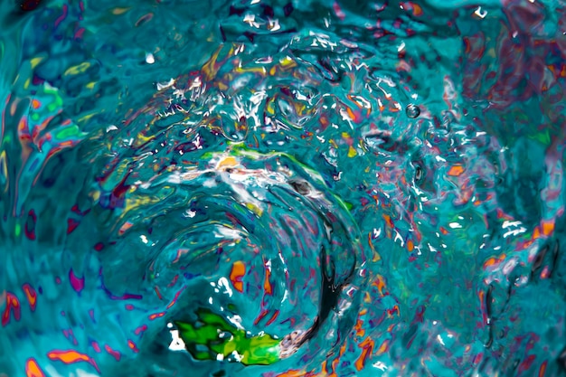 Water waves and colourful splashes top view