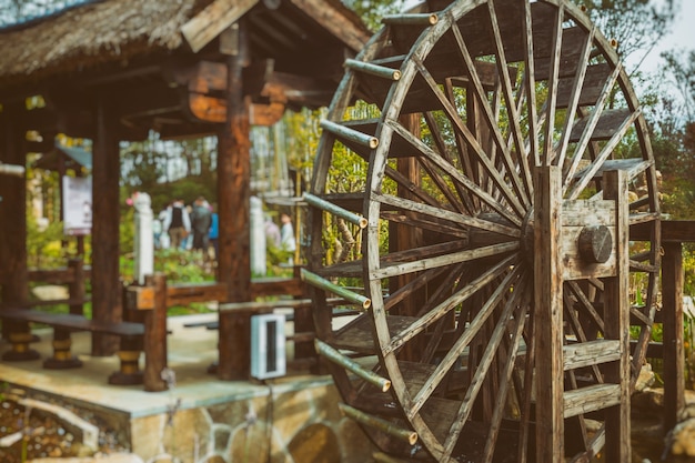 Free photo water wheels on river amidst trees