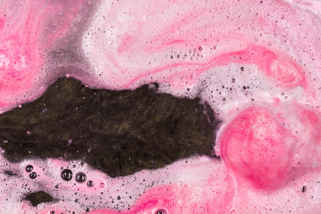 Water with pink bath bomb