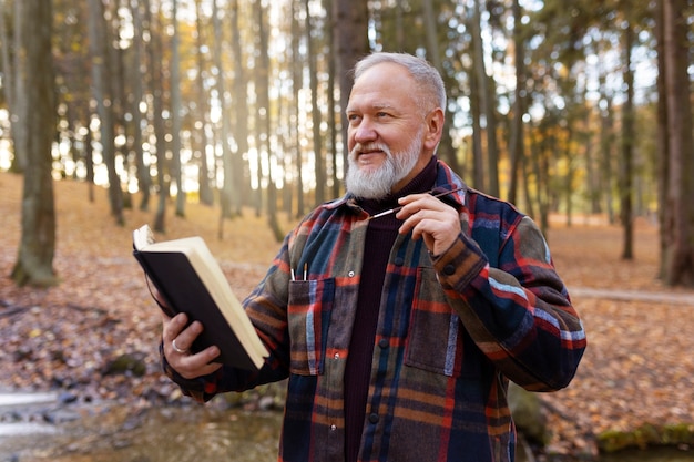 Free photo watercolor painting artist outdoors in the forest