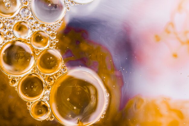 Watercolor yellow bubbles on defocused background