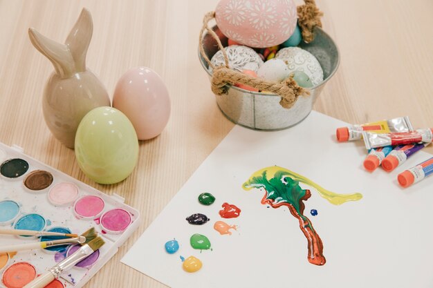 Watercolors and paper palette near Easter stuff