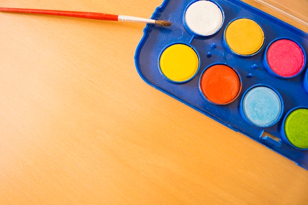 Watercolors on wooden desk