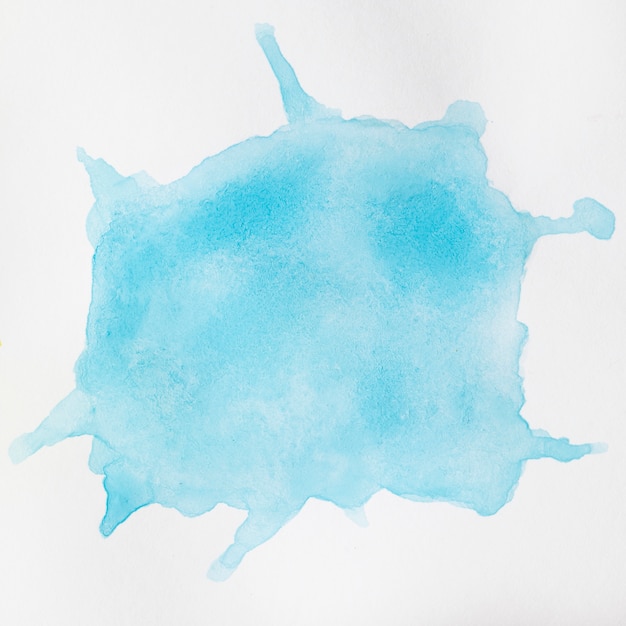 Free photo watercolour liquid blue splashes on white background