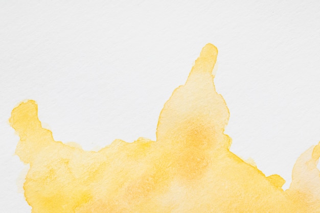 Watercolour liquid orange splashes on white background