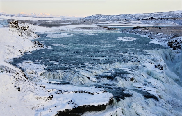 Waterfall of Gullfoss in Iceland, Europe surrounded by ice and snow