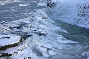 Free photo waterfall of gullfoss in iceland, europe surrounded by ice and snow