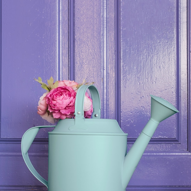 Watering can with roses