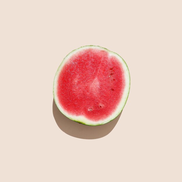 Watermelon cut on creamy background