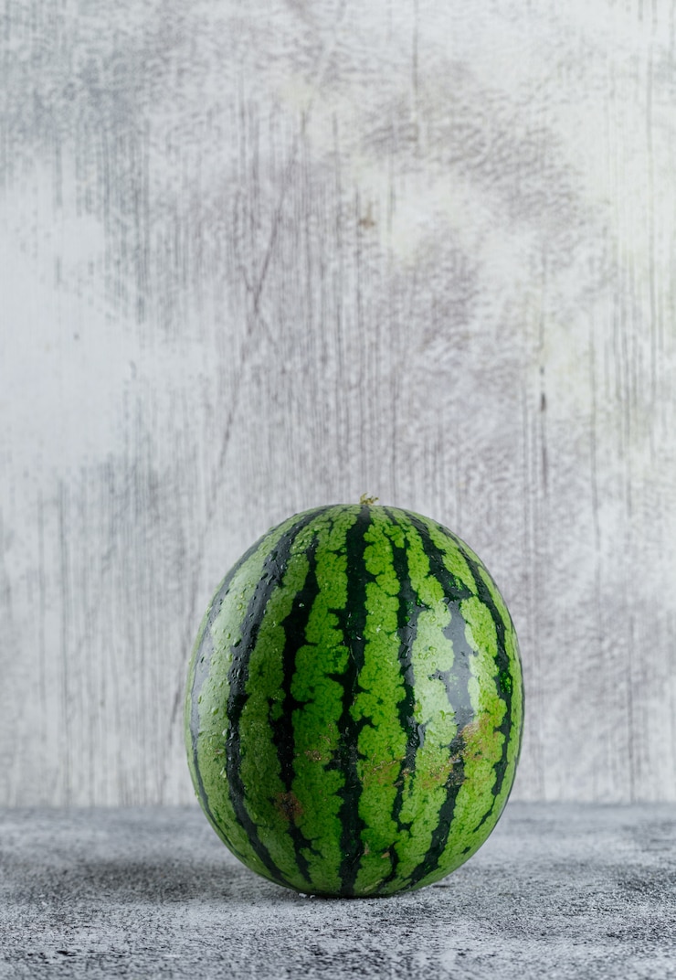 Free Photo watermelon on grey grunge table
