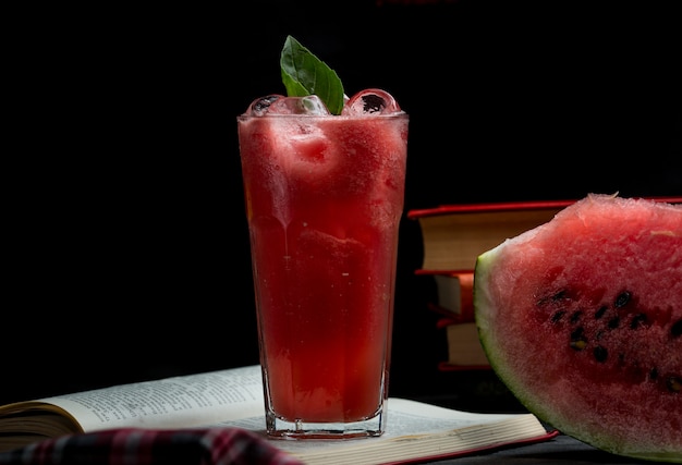 Free photo watermelon ice cold smoothie with mint leaves and a slice of watermelon