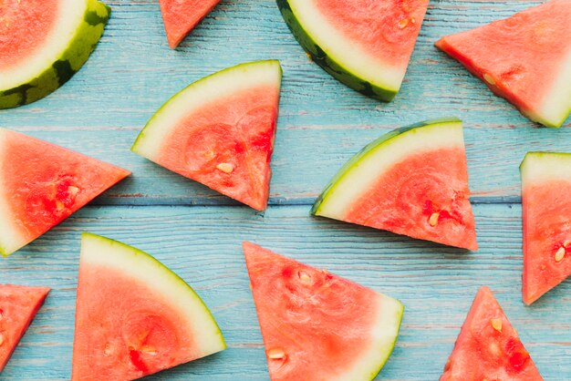 Watermelon pieces on wooden planks
