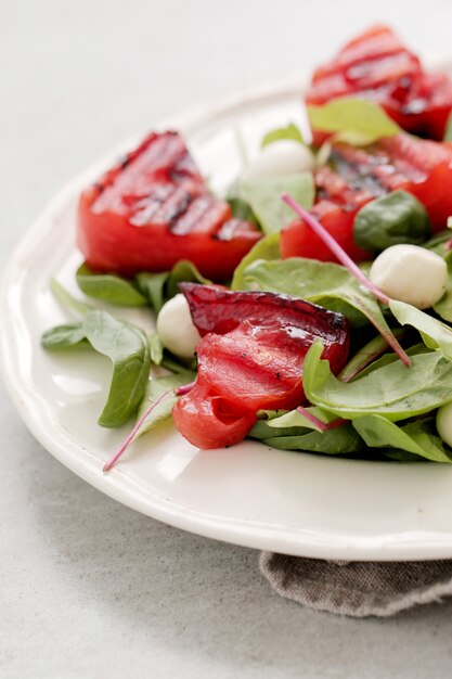 Watermelon salad on white plate