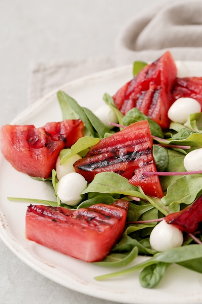 Watermelon salad on white plate