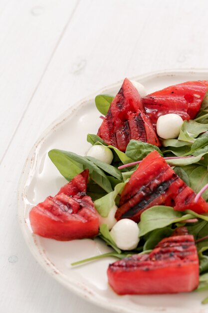 Watermelon salad on white plate