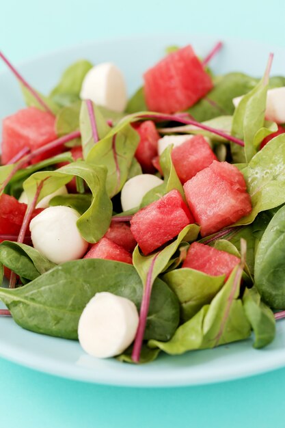 Watermelon salad on white plate