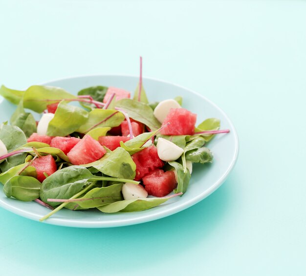 Watermelon salad on white plate