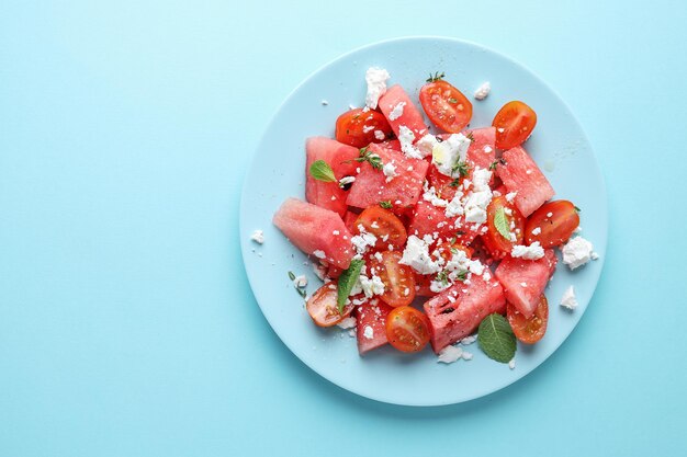 Watermelon salad with cheese served on plate