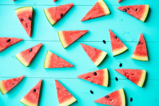 Watermelon slices on blue table