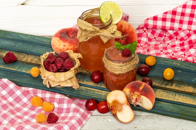 watermelon smoothie in a jar with peach, lime