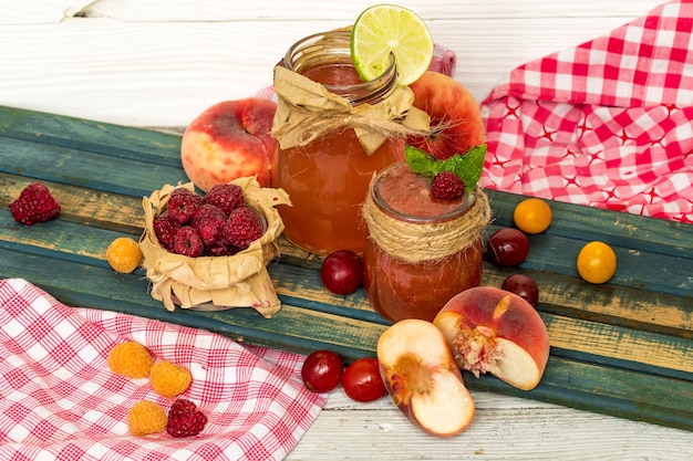 watermelon smoothie in a jar with peach, lime