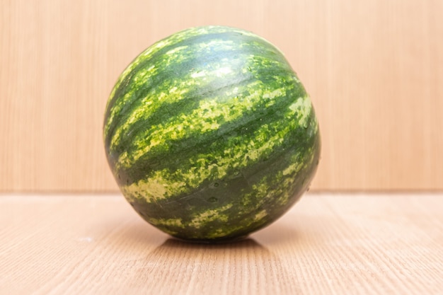 Free photo watermelon on wooden table