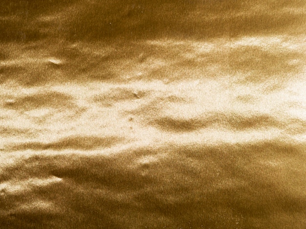 Free photo waves of gold texture background