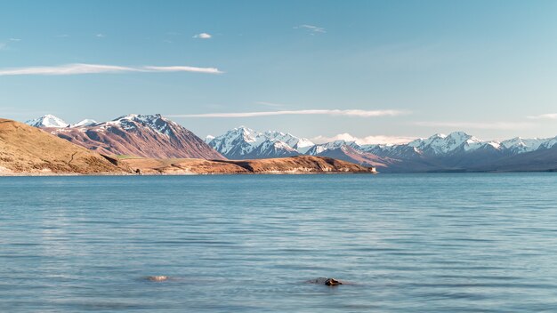 Wavy lake surrounded by mountains