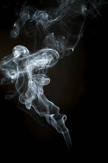 Free photo wavy silhouette of white smoke